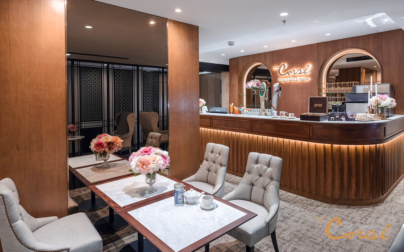 Coral First Class Lounge seating area and bar, Bangkok airport, Thailand.