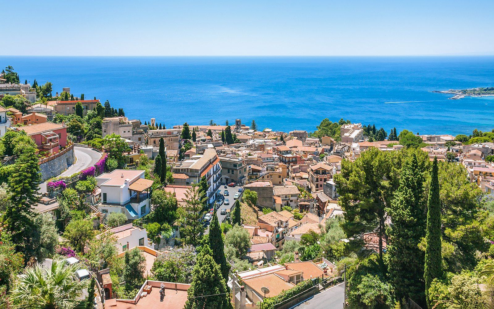 Taormina townscape with sea view, seen from Messina to Taormina transfer route.