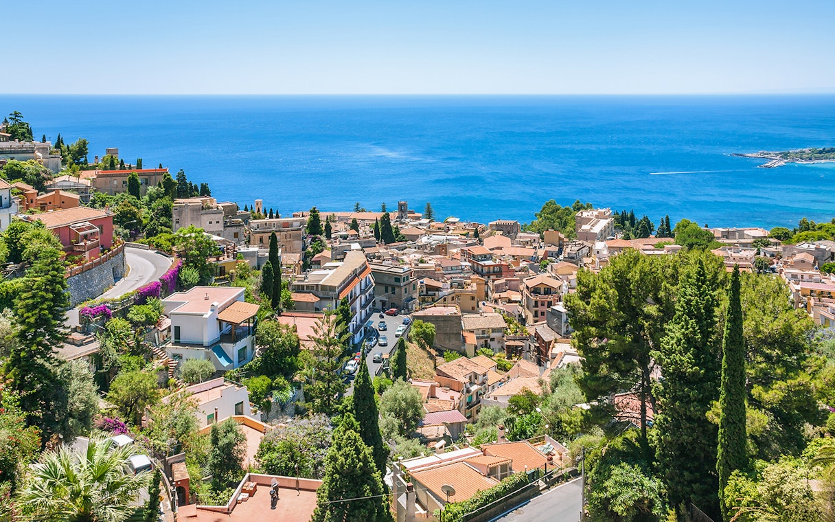 Taormina townscape with sea view, seen from Messina to Taormina transfer route.