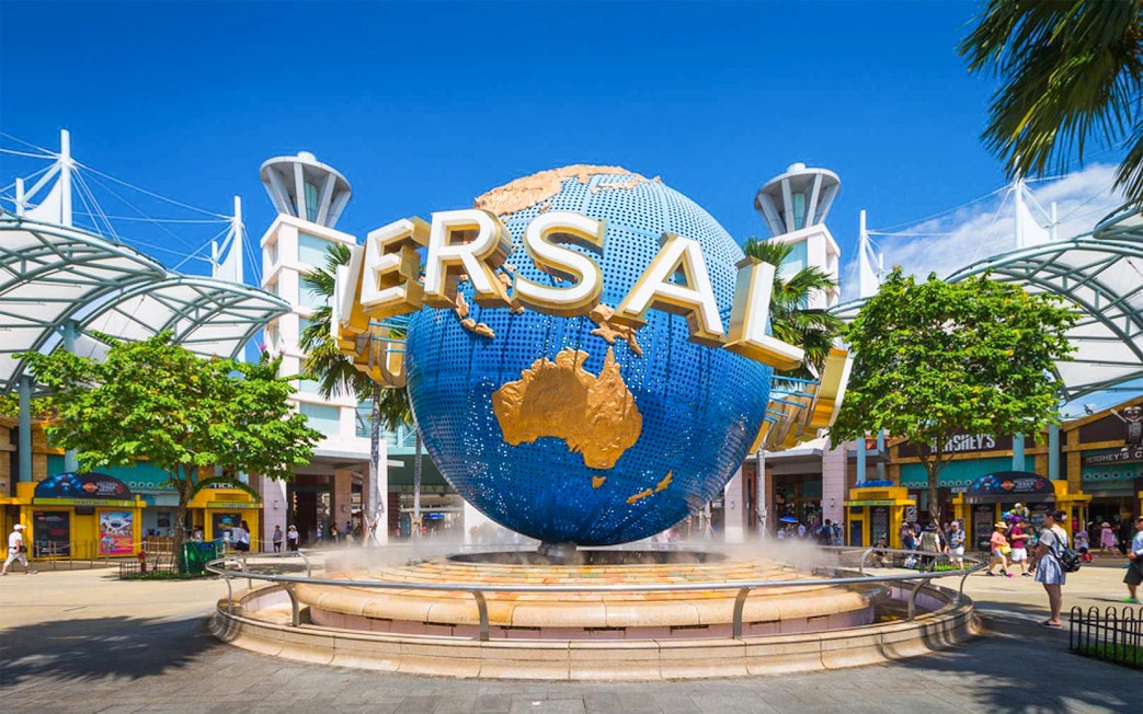 Universal Studios Singapore entrance with iconic globe sculpture.