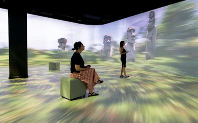 Visitors exploring immersive Easter Island exhibit at Immerse LDN: Timewalk Exhibition.