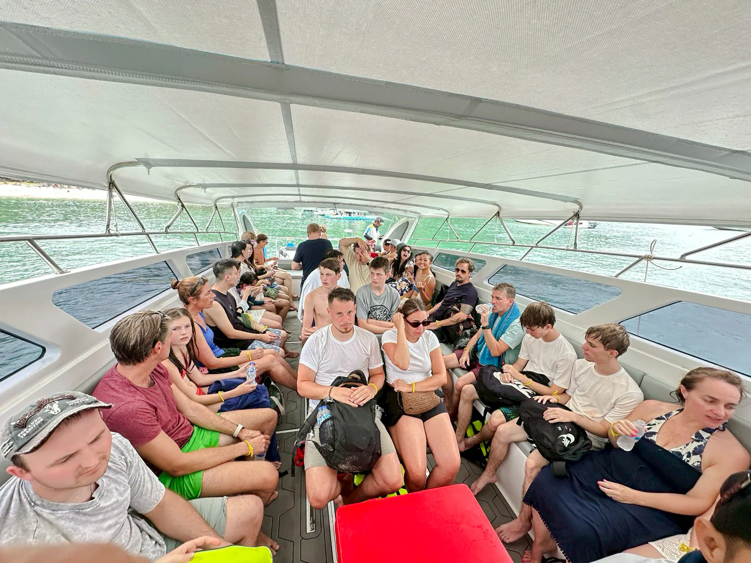 Tourists on a boat during island hopping adventure at Anthong Marine Park, Koh Samui.