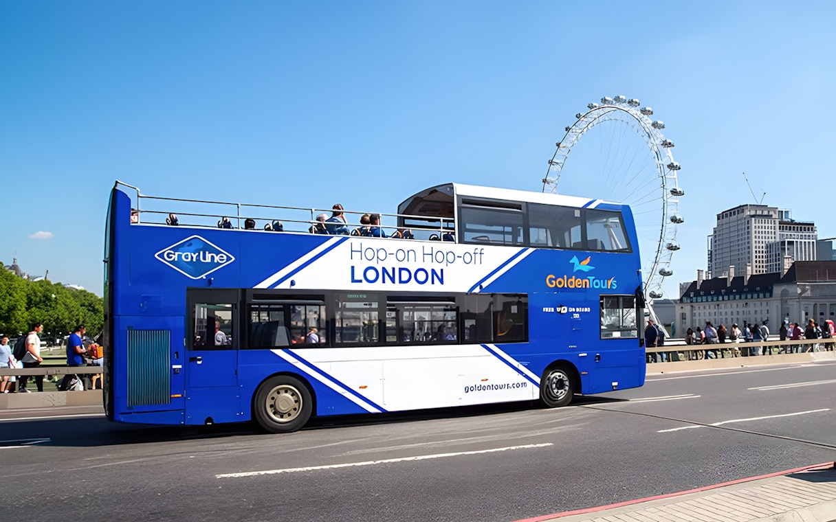 Open-top London tour bus near the London Eye.