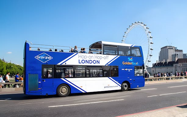 Open-top London tour bus near the London Eye.