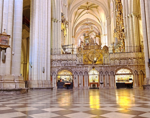 Toledo Cathedral's Mozarabic Rite Chapel interior with ornate arches and religious artwork.