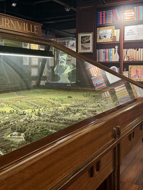 Model of Bourneville village at Cadbury World exhibit, showcasing historical layout and architecture.