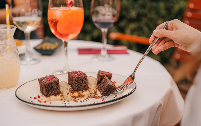 Dessert plate with chocolate squares at Tablao Jardines de Zoraya.