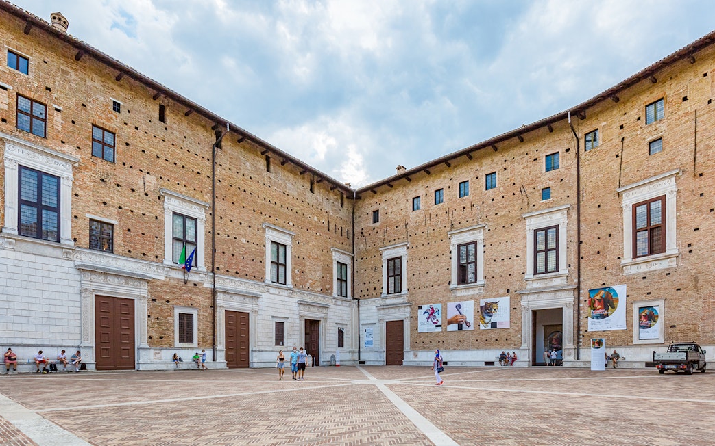 Renaissance courtyard at National Gallery of Marche inside Ducal Palace, Italy.