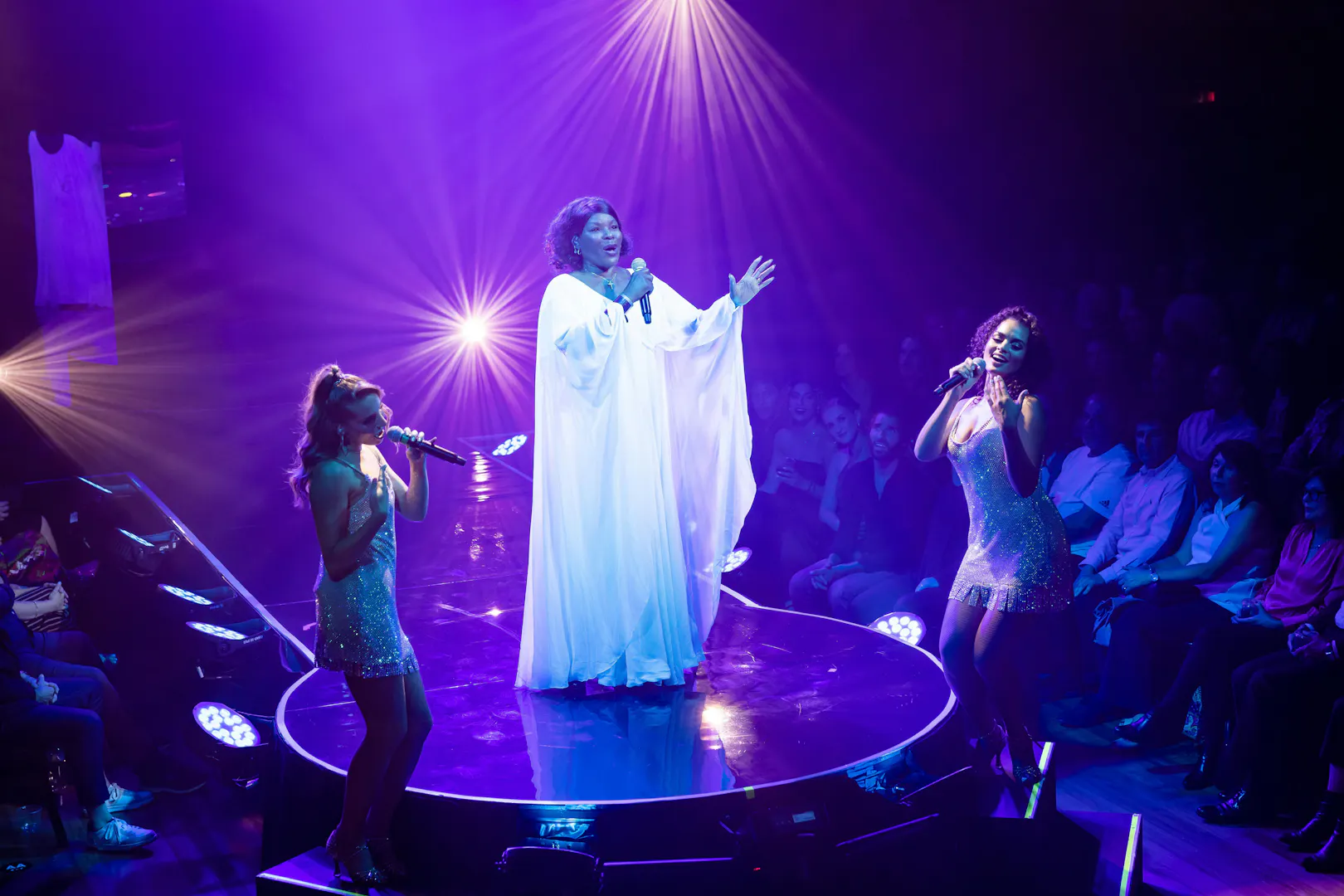 Singers performing on stage during Velvet Inferno show in Sydney.