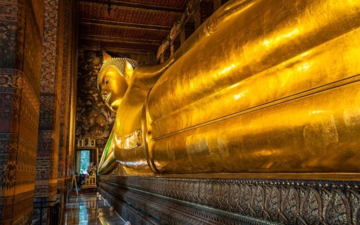 Reclining Buddha statue at Wat Pho, Bangkok, part of Grand Palace and temples tour.