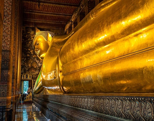 Reclining Buddha statue at Wat Pho, Bangkok, part of Grand Palace and temples tour.