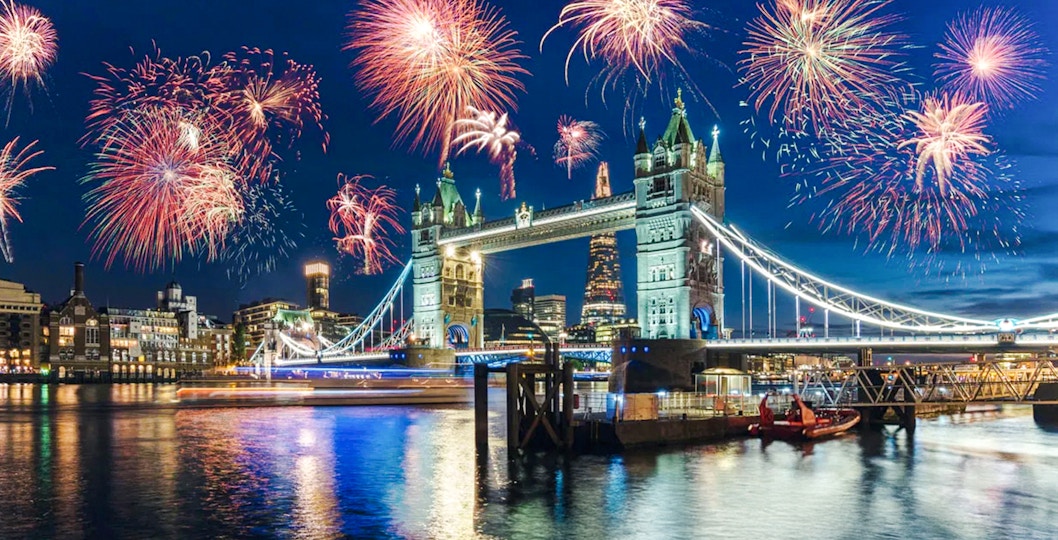 Fireworks over Tower Bridge on New Year's Eve, River Thames, London.