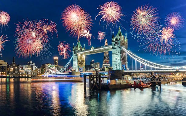 Fireworks over Tower Bridge on New Year's Eve, River Thames, London.