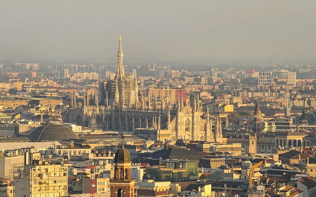 Aerial view of Milan featuring the Duomo and cityscape.