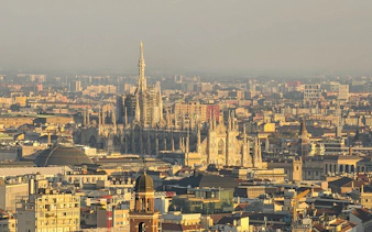 Aerial view of Milan featuring the Duomo and cityscape.
