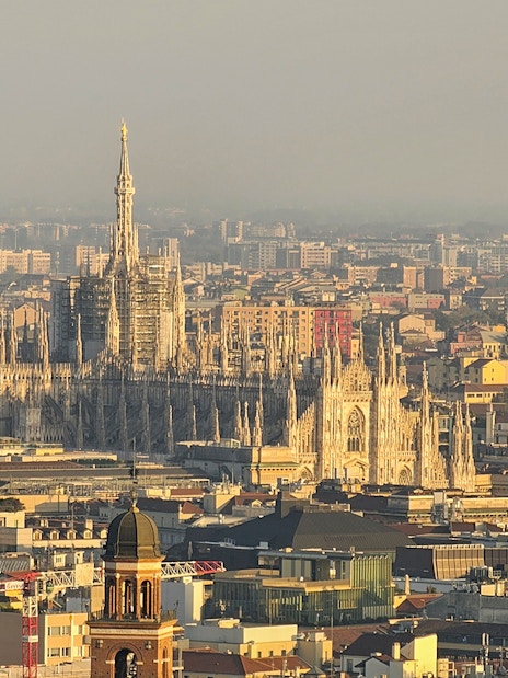Aerial view of Milan featuring the Duomo and cityscape.