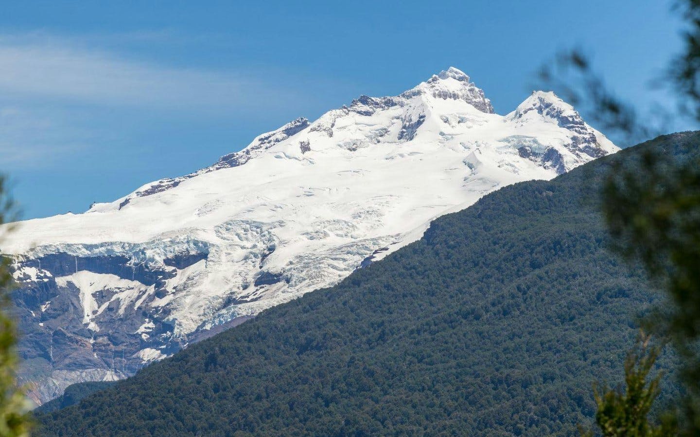 Snow-capped Mount Tronador above forests in Nahuel Huapi National Park.