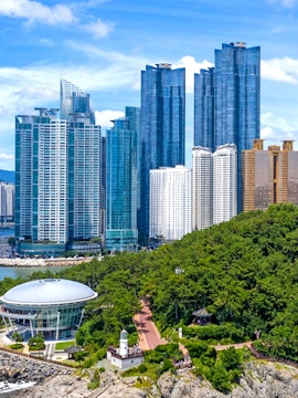 Skyscrapers and coastal park view at Blueline Park, Busan, South Korea.