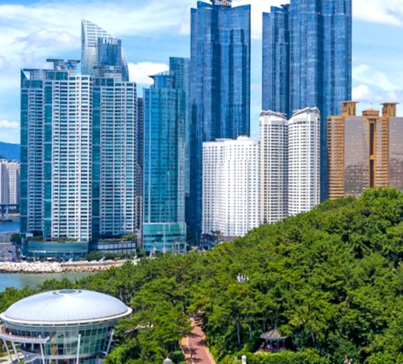 Skyscrapers and coastal park view at Blueline Park, Busan, South Korea.