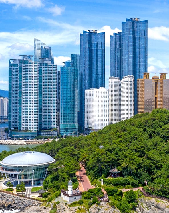 Skyscrapers and coastal park view at Blueline Park, Busan, South Korea.