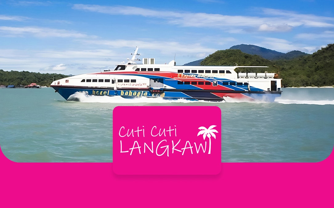 Ferry cruising through Langkawi waters with lush hills in the background.