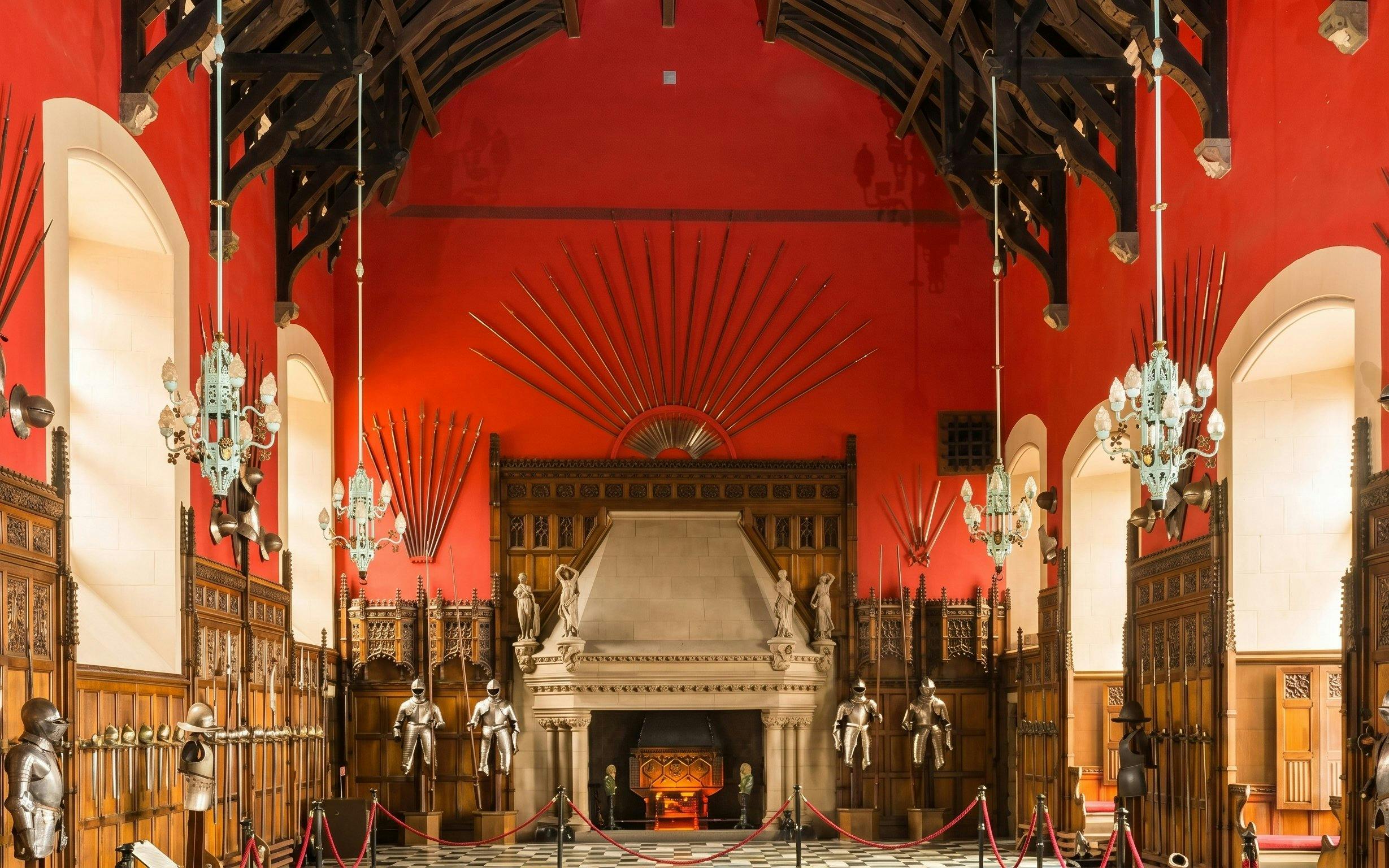 Great Hall interior with medieval armor and weapons display at Edinburgh Castle.
