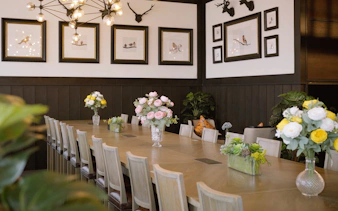 Coral International Lounge meeting room with floral centerpieces at Phuket International Airport.