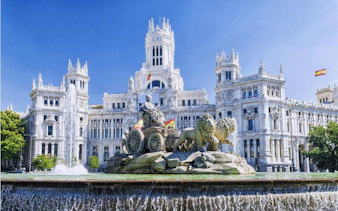 Cibeles Fountain and Palacio de Cibeles in Madrid, part of self-guided city exploration game.