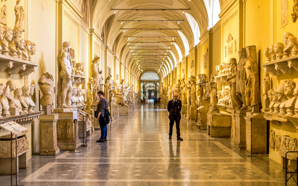 Vatican Museums gallery with classical sculptures, Rome.