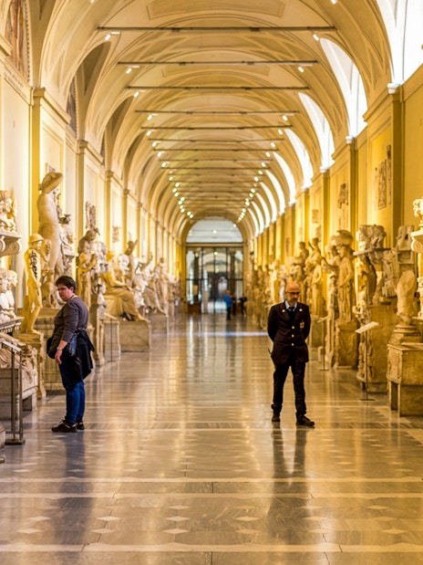 Vatican Museums gallery with classical sculptures, Rome.