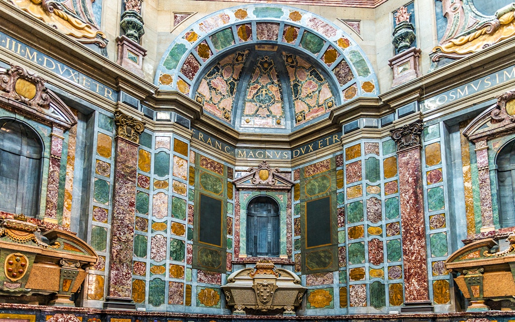 Medici Chapels interior with ornate marble walls and decorative arches in Florence, Italy.