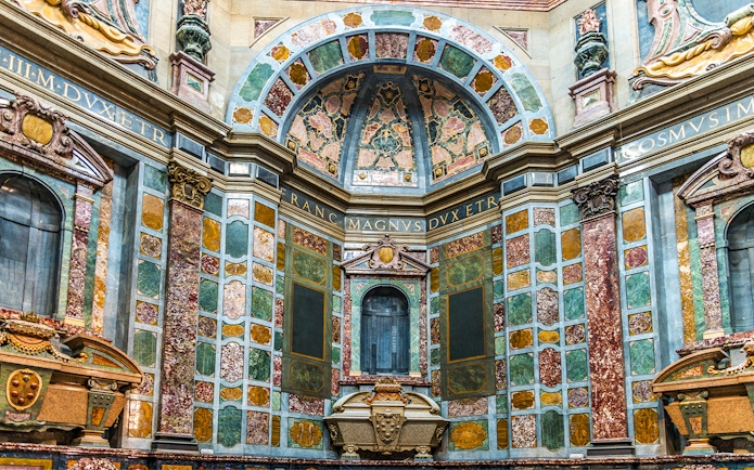 Medici Chapels interior with ornate marble walls and decorative arches in Florence, Italy.