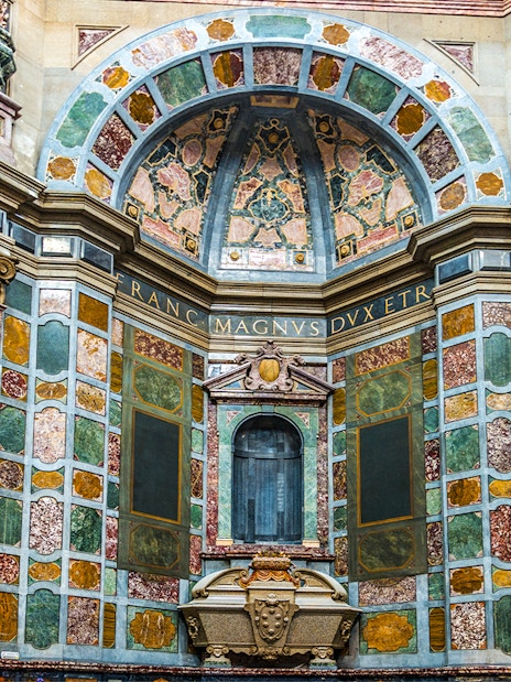 Medici Chapels interior with ornate marble walls and decorative arches in Florence, Italy.