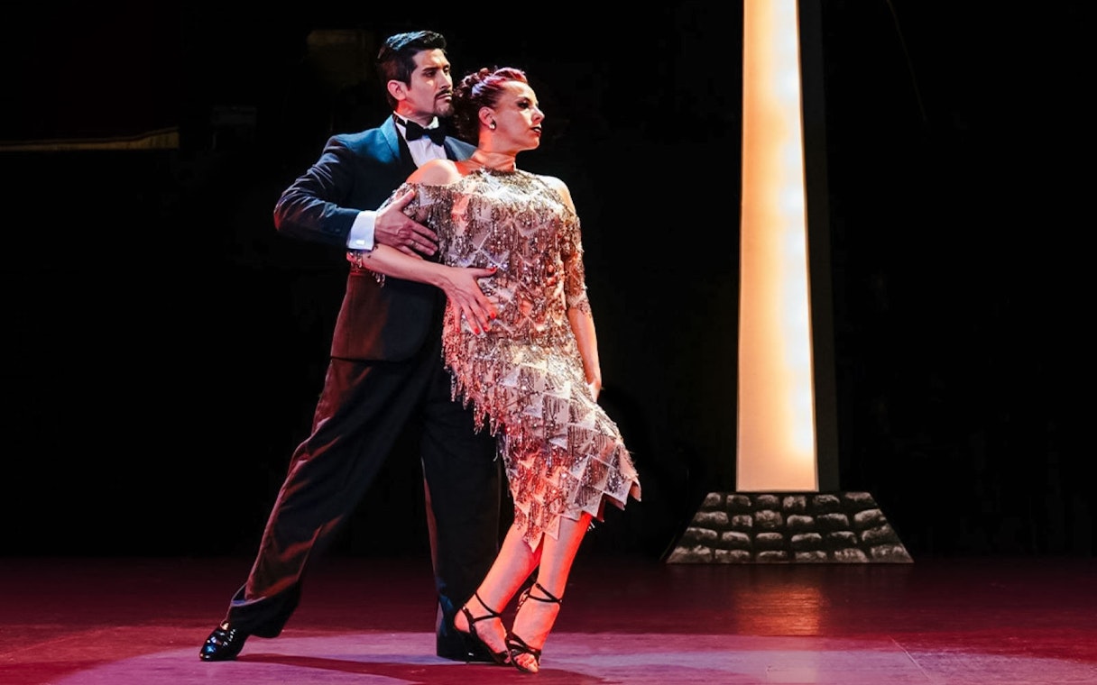 Tango dancers performing at Tango Porteño Show in Buenos Aires.