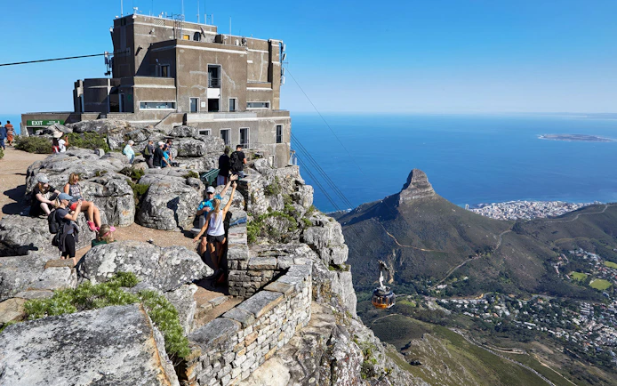 Table Mountain cable car station with views of Lion's Head and Cape Town below.