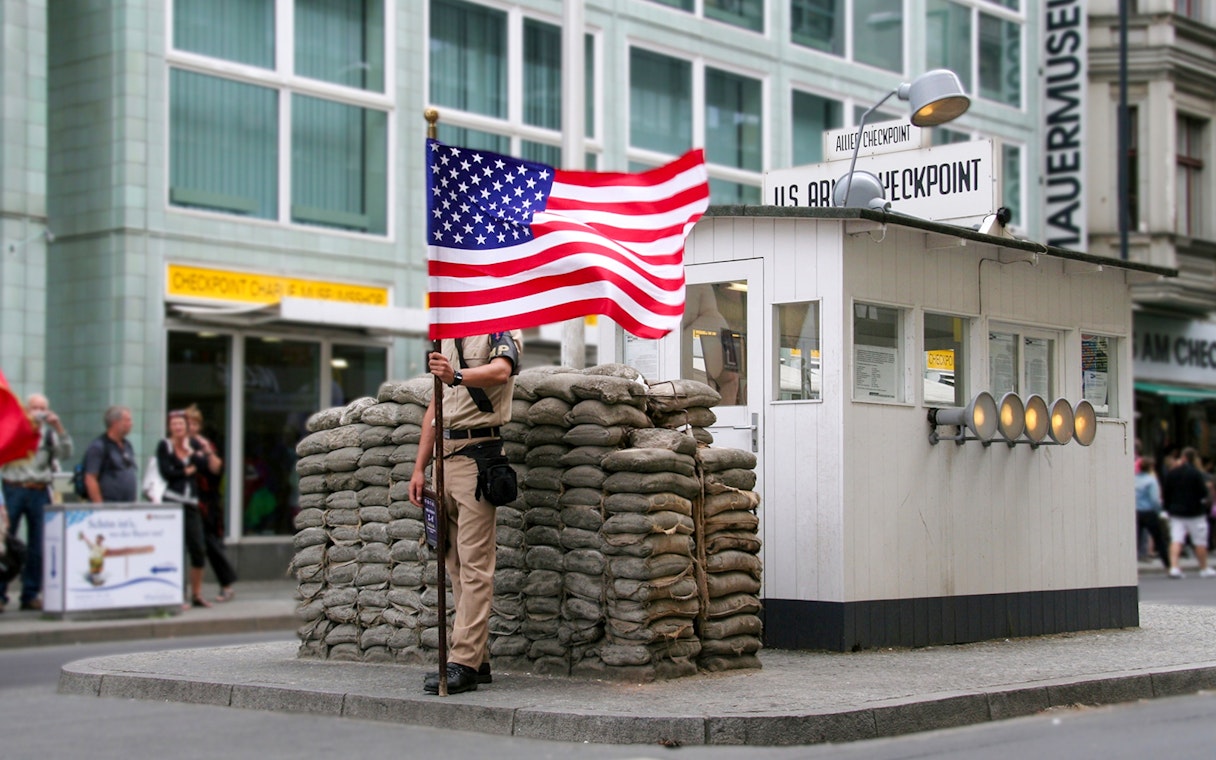 Checkpoint Charlie guard post with American flag, Berlin, part of Guided Bike Tour: Third Reich & The Wall.