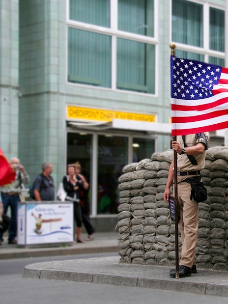 Checkpoint Charlie guard post with American flag, Berlin, part of Guided Bike Tour: Third Reich & The Wall.