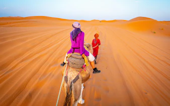 Camel ride through the Sahara Desert dunes.