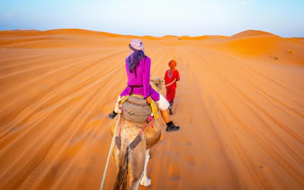 Camel ride through the Sahara Desert dunes.