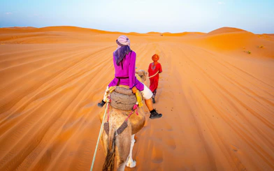 Camel ride through the Sahara Desert dunes.