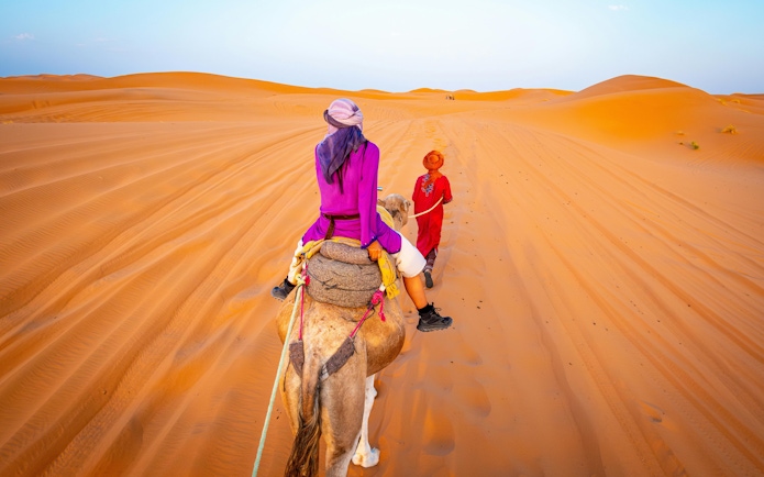 Camel ride through the Sahara Desert dunes.