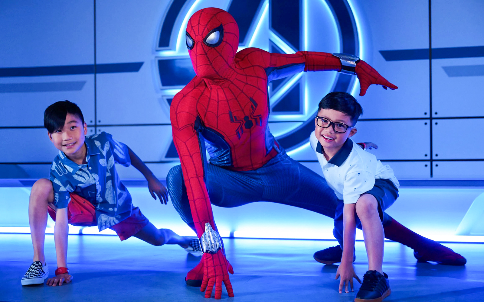 Children posing with superhero character on Disney Adventure Cruise from Singapore.