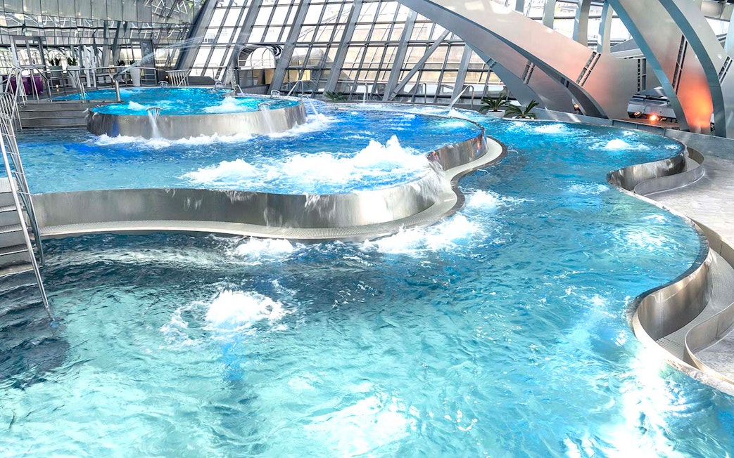 Thermal pools with modern architecture at Caldea spa complex, Andorra.