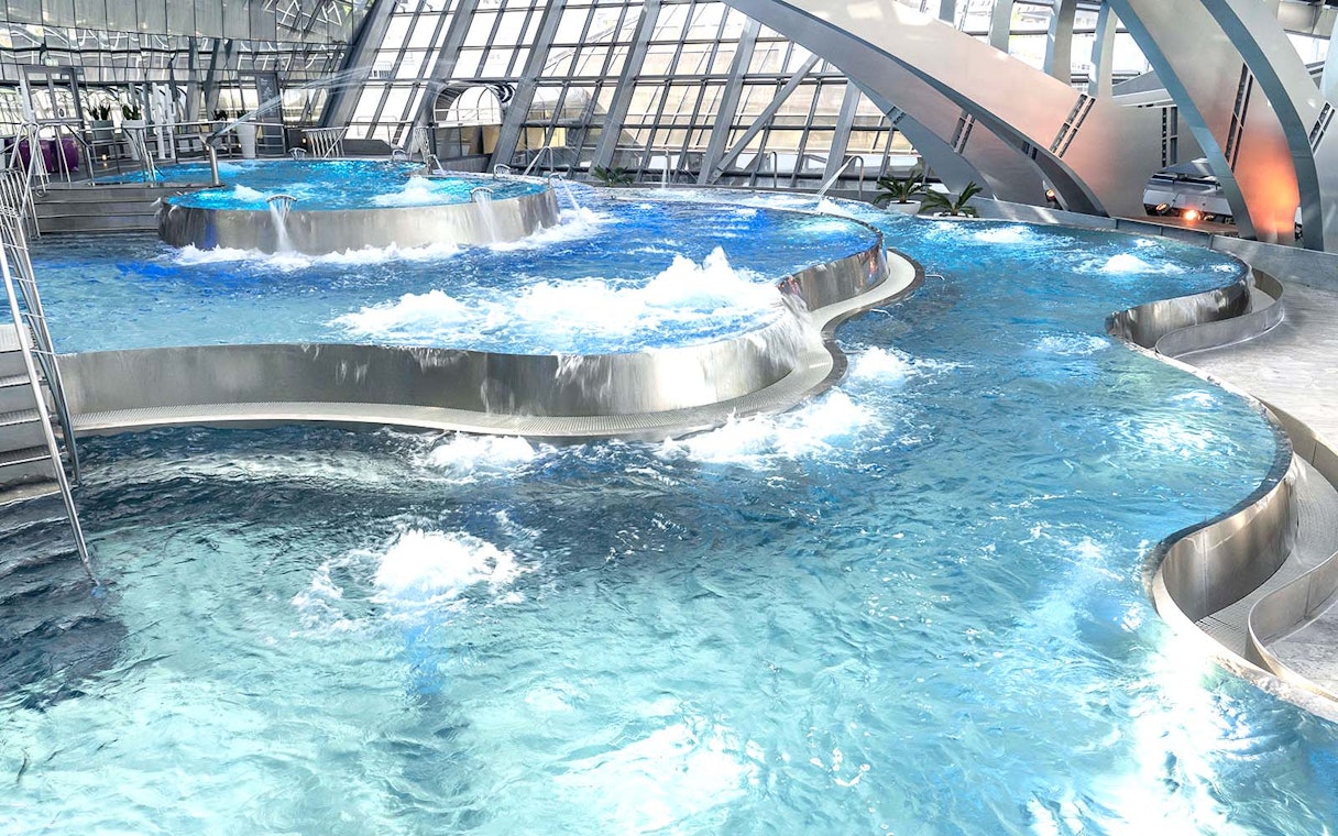 Thermal pools with modern architecture at Caldea spa complex, Andorra.