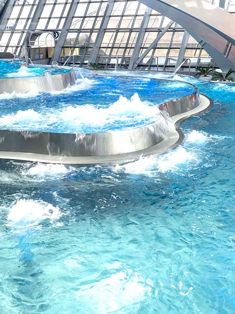 Thermal pools with modern architecture at Caldea spa complex, Andorra.