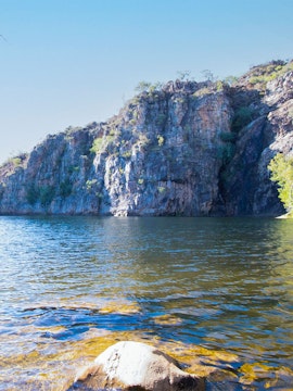 Katherine Gorge cliffside view with calm water in Nitmiluk National Park, Australia.