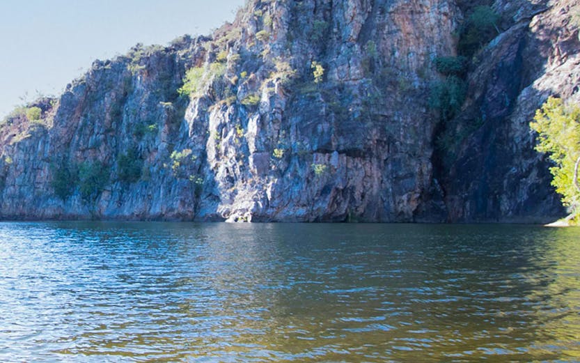 Katherine Gorge cliffside view with calm water in Nitmiluk National Park, Australia.