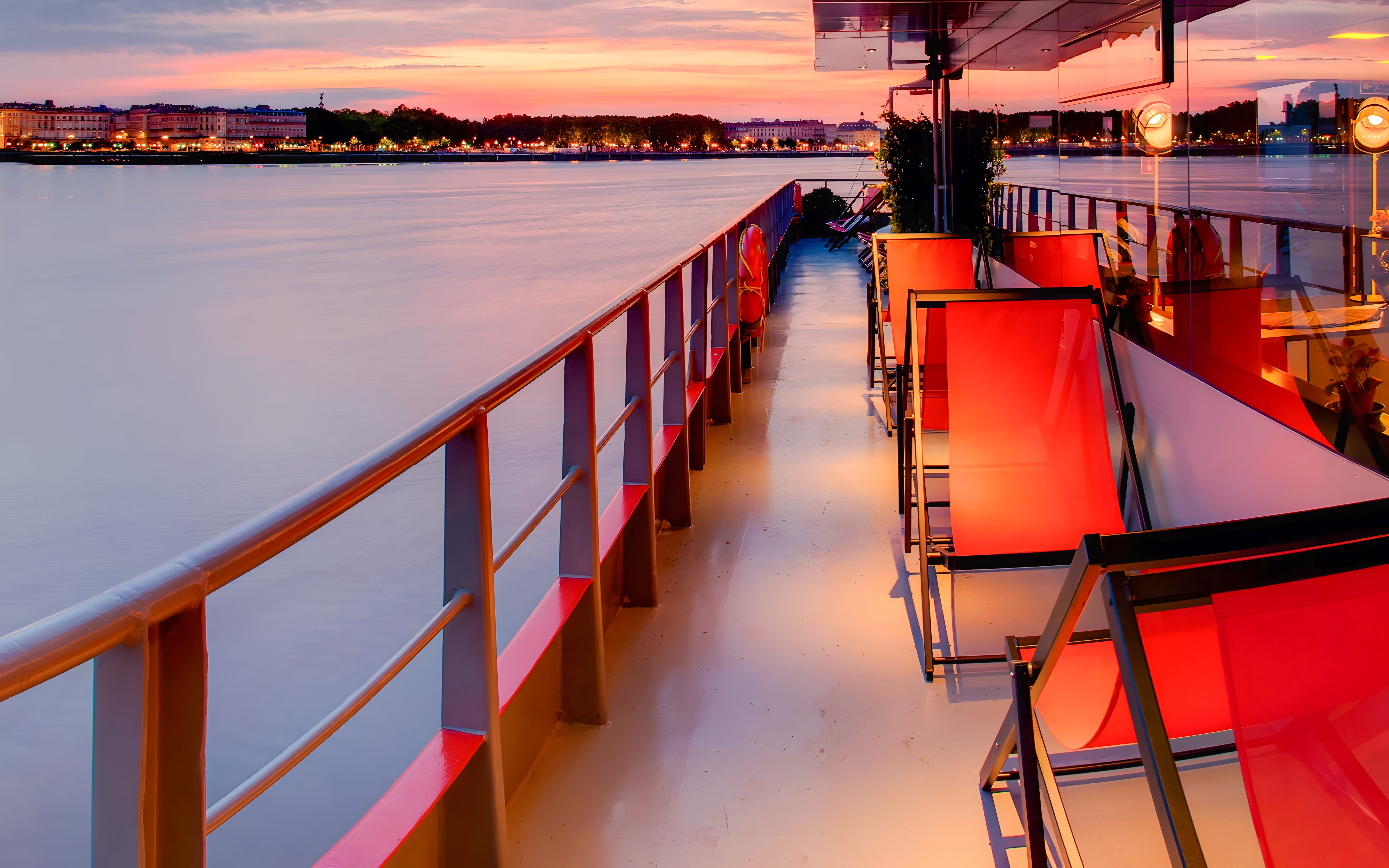 Deck view of Bateaux Bordelais Dinner Cruise at sunset on the Garonne River, Bordeaux.