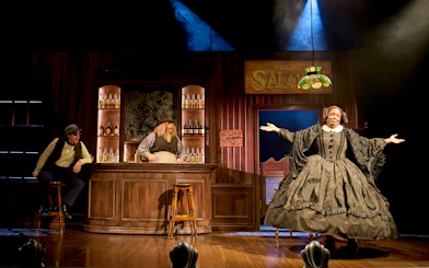Theater scene from "Oh Mary" at West End with actors in a saloon setting.
