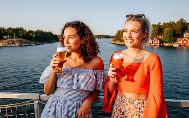 Guests enjoying craft beer on Archipelago Island Cruise, Stockholm.